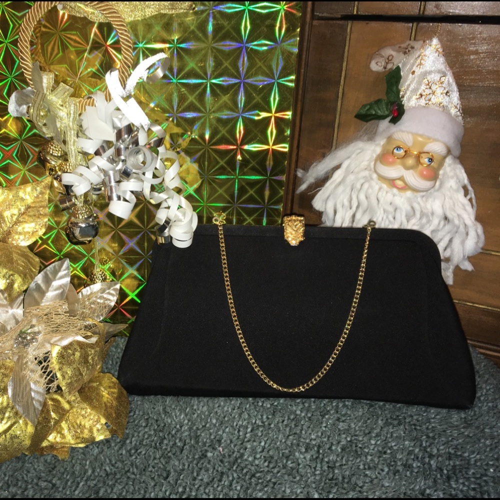 Sophisticated black clutch with goldtoned clasp